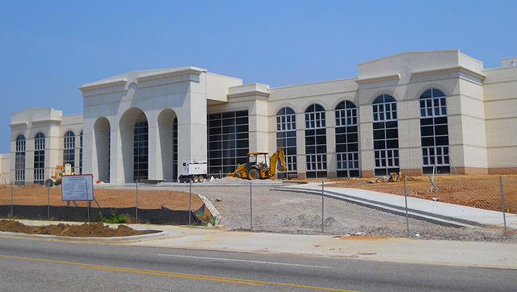 Projects: View of front of high school building under construction