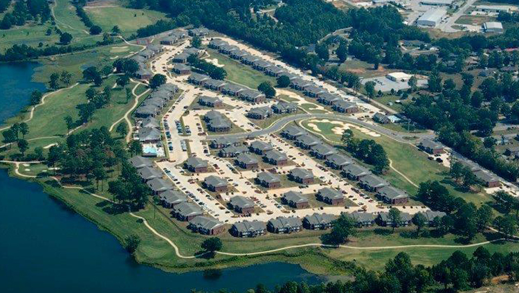 Projects: Aerial photo of large apartment complex near water